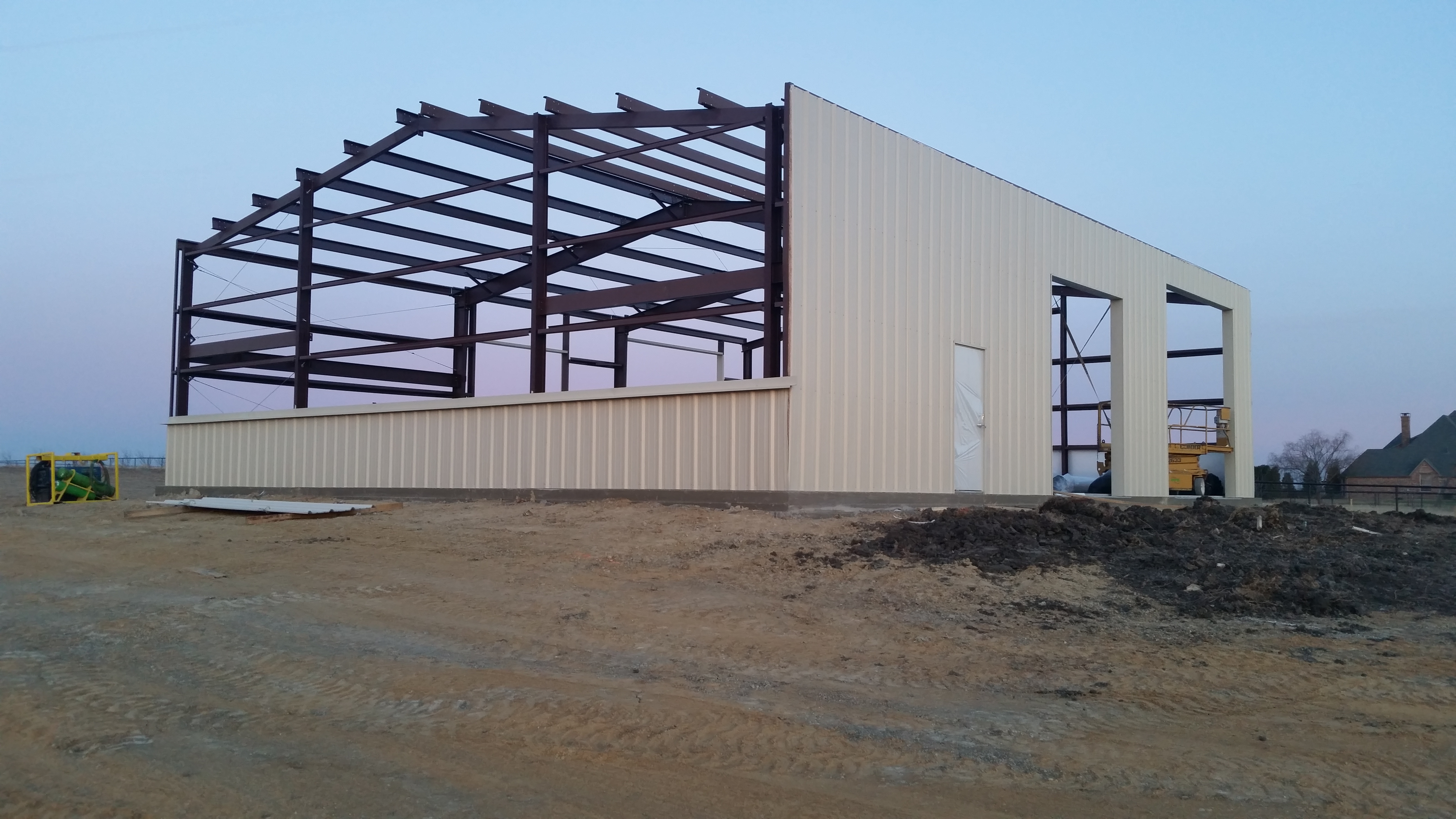 Residential shop steel frame and metal siding under construction in Heath, Texas
