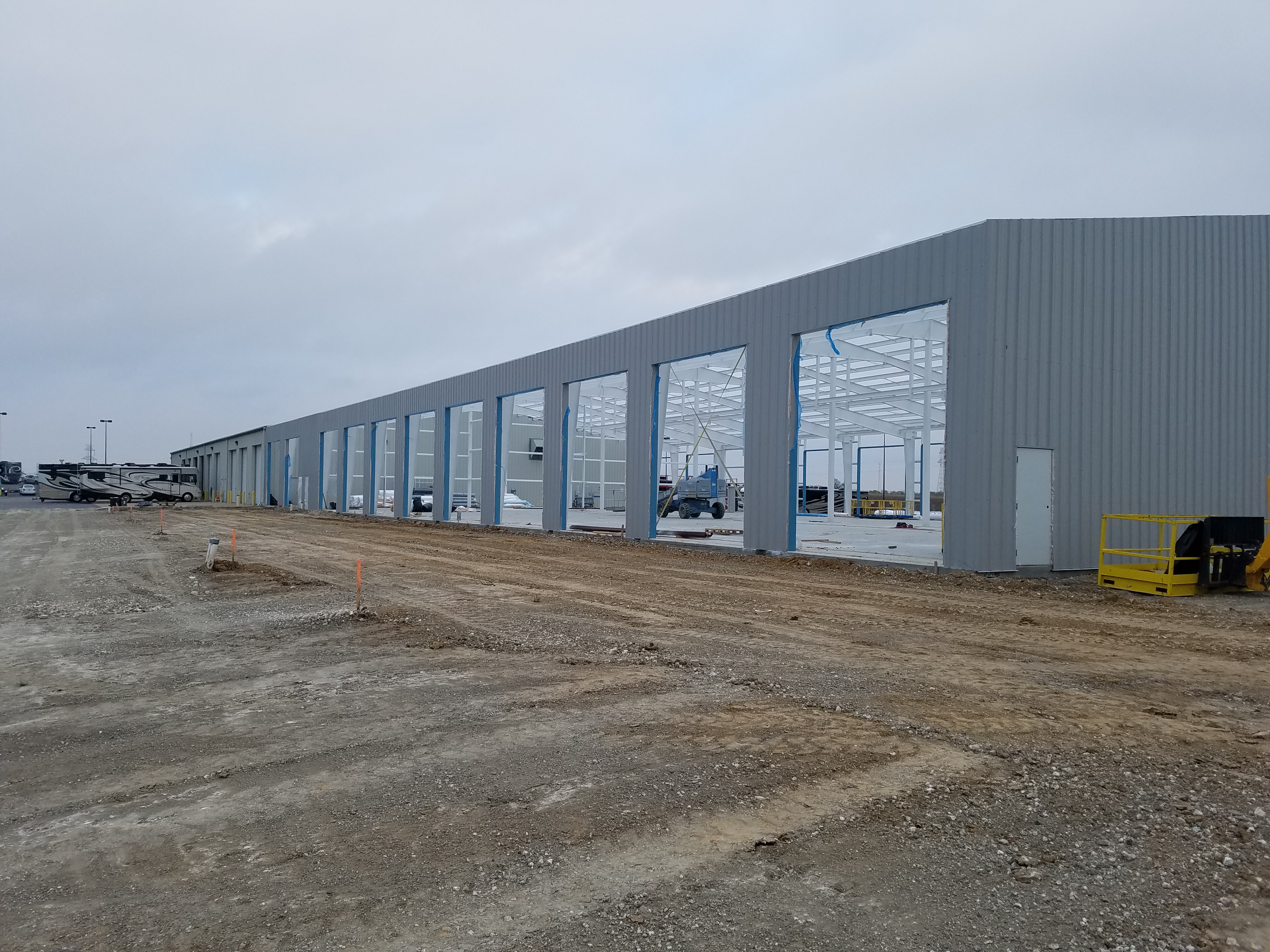 Long exterior view of RV facility bays in Alvarado, Texas