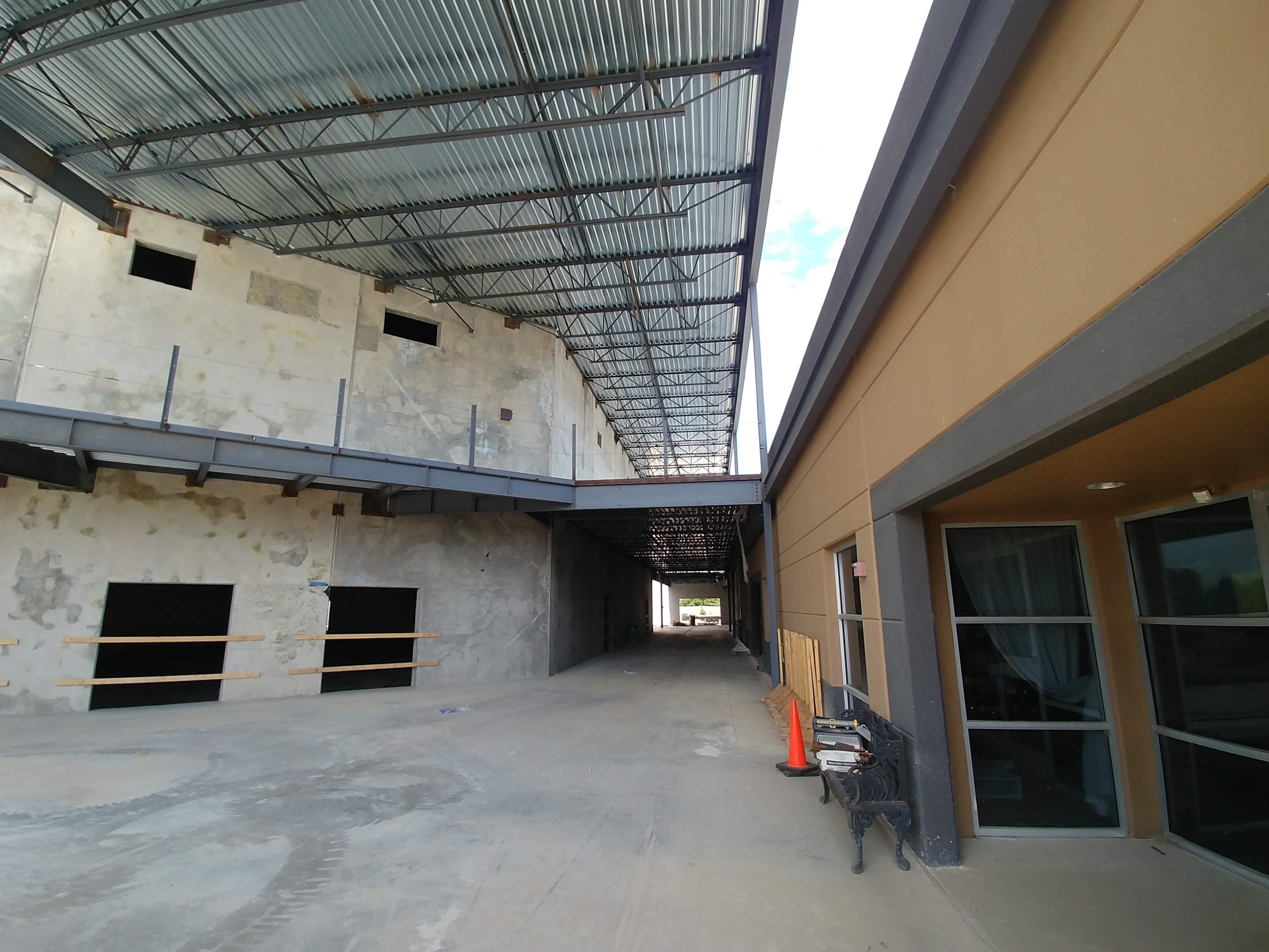 Church of God covered walkway and building exterior during construction