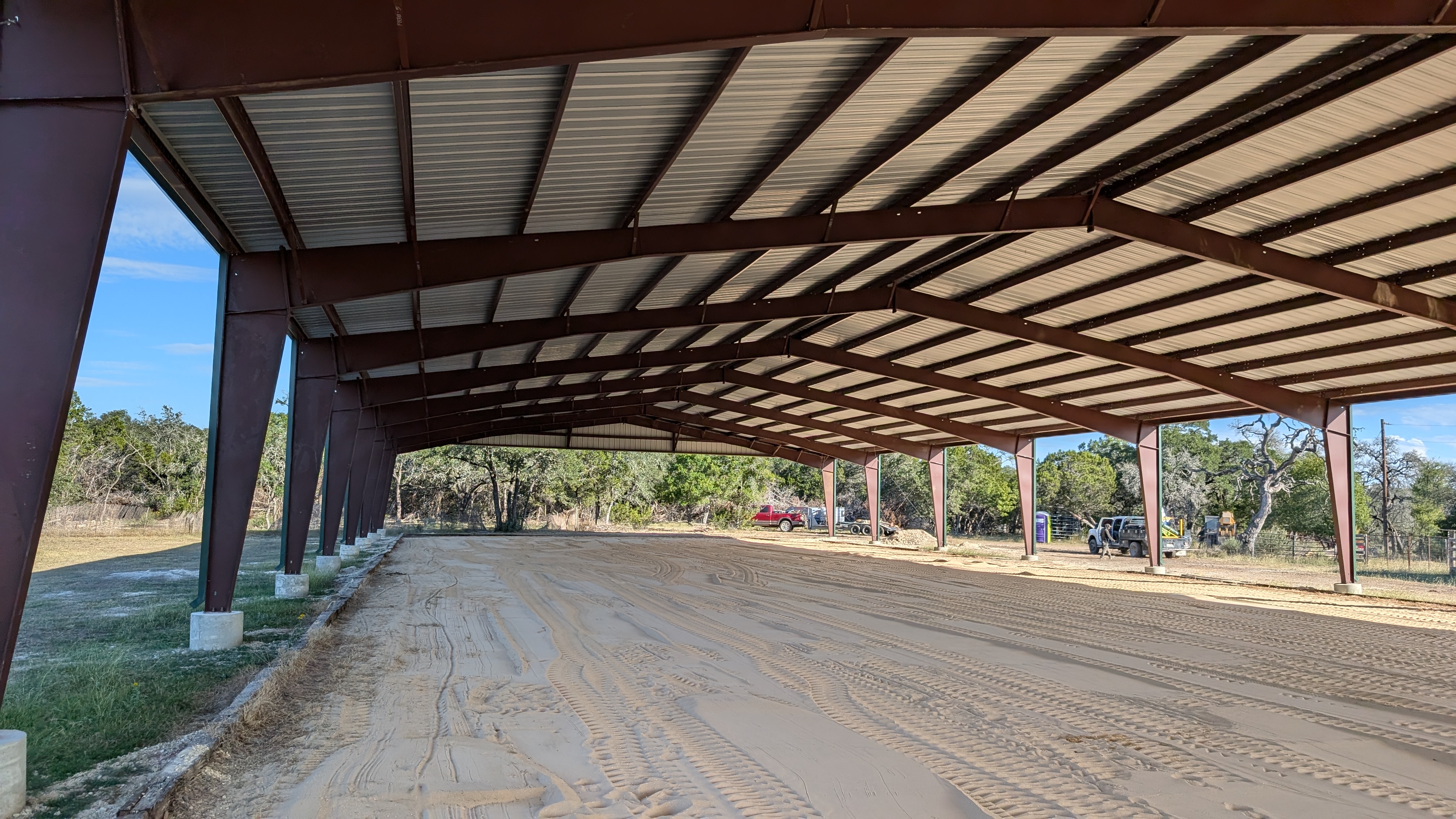 Covered riding arena interior and sand footing in Boerne, Texas
